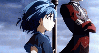 A Girl With Blue Hair Stands Next To A Man In A Tuxedo GIF