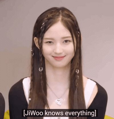 A Girl With Braids And A Necklace Says Jiwoo Knows Everything . GIF