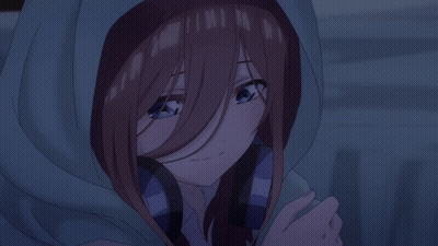 A Girl With Brown Hair And Blue Eyes Is Wearing A Hooded Jacket GIF