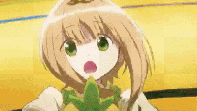 A Girl With Brown Hair And Green Eyes Is Holding A Green Object In Her Mouth GIF