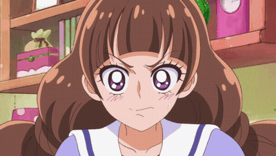 A Girl With Brown Hair And Purple Eyes Is Making A Angry Face GIF
