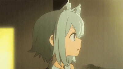 A Girl With Cat Ears Is Standing In A Room And Looking At Something . GIF