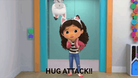 A Girl With Cat Ears Is Standing In Front Of An Elevator And Says " Hug Attack " GIF