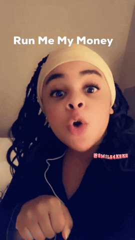 A Girl With Dreadlocks Is Wearing A Headband That Says Run Me My Money On It GIF