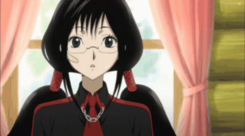 A Girl With Glasses And A Chain Around Her Neck Is Standing In Front Of A Window With A Pink Curtain GIF