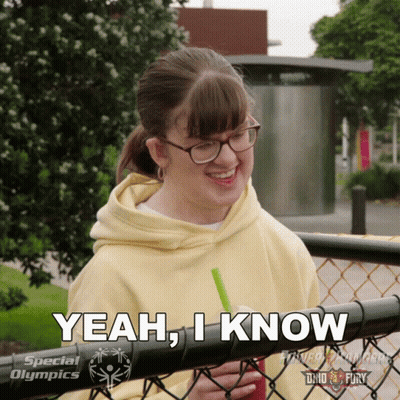 A Girl With Glasses And A Yellow Hoodie Says " Yeah , I Know " GIF