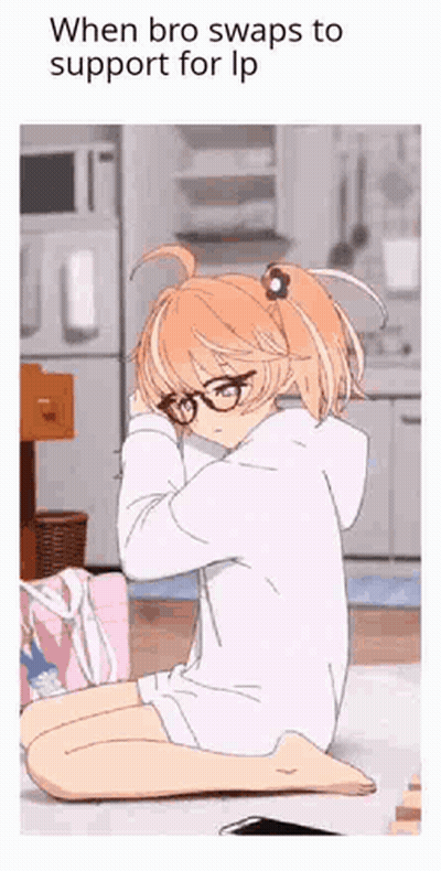 A Girl With Glasses Is Sitting On The Floor With Her Head On Her Knees . GIF