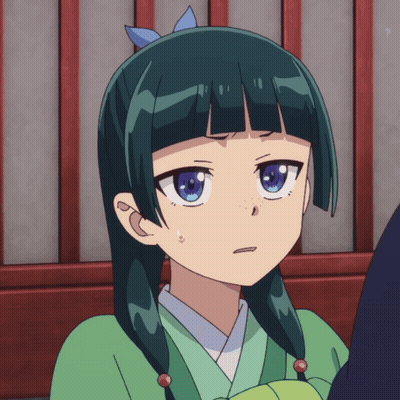 A Girl With Green Hair And Blue Eyes Is Making A Face GIF