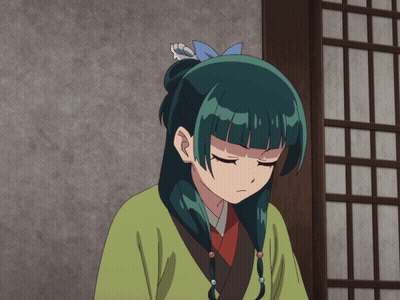 A Girl With Green Hair And Blue Eyes Is Wearing A Green Shirt GIF