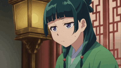 A Girl With Green Hair And Blue Eyes Looks Angry GIF