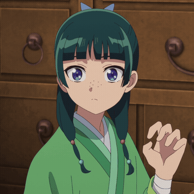 A Girl With Green Hair And Blue Eyes Stands In Front Of A Dresser GIF
