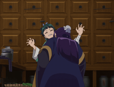 A Girl With Green Hair And Purple Hair Is Hugging A Man With Purple Hair GIF