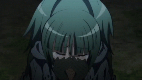 A Girl With Green Hair Is Crying With Her Hands Over Her Face GIF