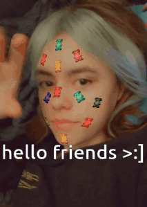 A Girl With Gummy Bears On Her Face And The Words Hello Friends GIF