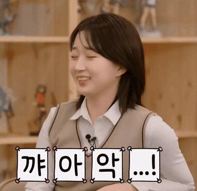 A Girl With Her Eyes Closed And A Sign That Says ' I 'M Sorry ' GIF