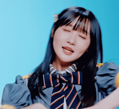 a girl with her eyes closed and a striped tie on