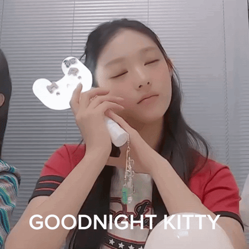 A Girl With Her Eyes Closed Has The Words Goodnight Kitty Written Below Her GIF