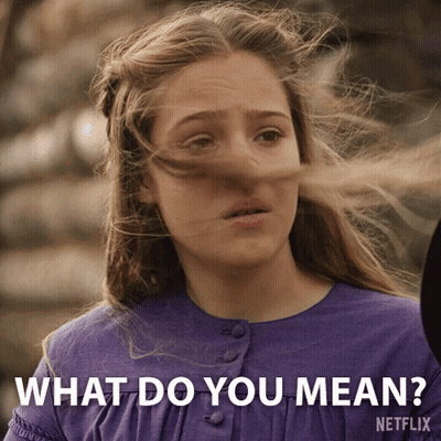 A Girl With Her Hair Blowing In The Wind Is Asking What Do You Mean GIF