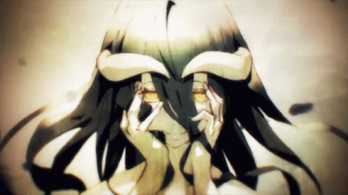 A Girl With Horns On Her Head Covering Her Eyes With Her Hands GIF