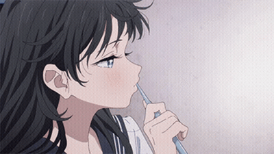 A Girl With Long Black Hair Is Brushing Her Teeth With A Toothbrush . GIF