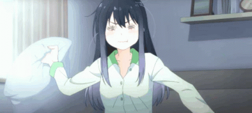 A Girl With Long Black Hair Is Holding A Pillow GIF