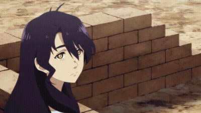 A Girl With Long Black Hair Is Leaning Against A Wall GIF