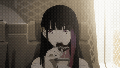 A Girl With Long Black Hair Is Sitting In A Chair Eating A Chocolate Bar GIF