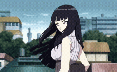 A Girl With Long Black Hair Is Standing In Front Of A Building GIF