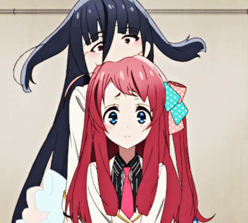 A Girl With Long Black Hair Is Standing Next To Another Girl With Pink Hair GIF