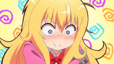 A Girl With Long Blonde Hair Is Making A Funny Face . GIF
