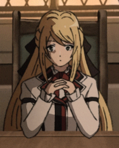 A Girl With Long Blonde Hair Is Sitting At A Desk With Her Hands Folded GIF