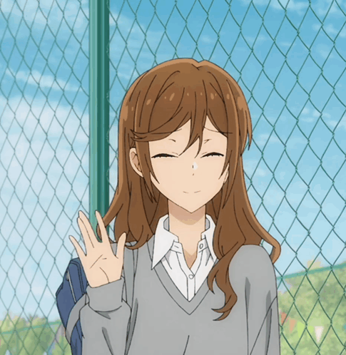 A Girl With Long Brown Hair Is Standing In Front Of A Chain Link Fence With Her Eyes Closed GIF