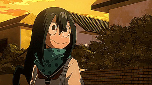 A Girl With Long Green Hair And A Scarf Around Her Neck Is Standing In Front Of A Building . GIF