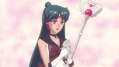 A Girl With Long Hair Is Holding A Cat And A Wand With A Heart On It GIF