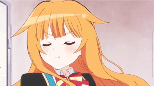 A Girl With Long Orange Hair Is Wearing A School Uniform And A Red Bow Tie . GIF