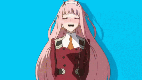 A Girl With Long Pink Hair And Horns Is Standing In Front Of A Green Background . GIF