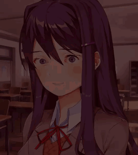 A Girl With Long Purple Hair And Glasses Is Smiling In A Classroom GIF