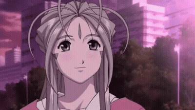 A Girl With Long White Hair And A Crown On Her Head Is Standing In Front Of A Purple Building . GIF