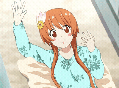 A Girl With Orange Hair And A Flower In Her Hair GIF
