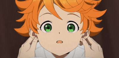 A Girl With Orange Hair And Green Eyes Covering Her Ears With Her Hands GIF