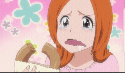 A Girl With Orange Hair Is Crying While Holding A Piece Of Food GIF
