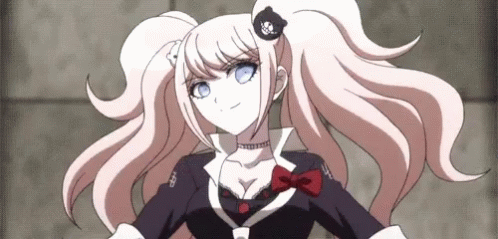 A Girl With Pigtails And Blue Eyes Is Wearing A Black And White Outfit GIF