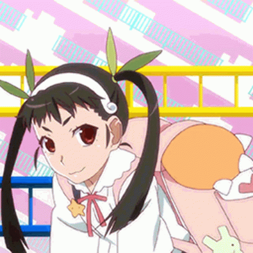A Girl With Pigtails Is Holding A Stuffed Animal In Her Hand GIF