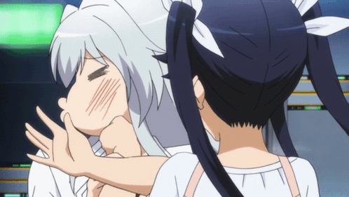 A Girl With Pigtails Is Kissing Another Girl 'S Cheek GIF