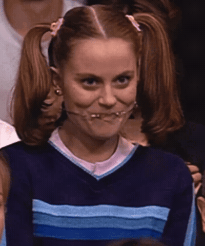 A Girl With Pigtails Is Wearing A Blue And White Striped Sweater GIF