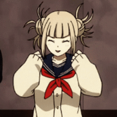 A Girl With Pigtails Is Wearing A Sailor Uniform With A Red Tie Around Her Neck . GIF