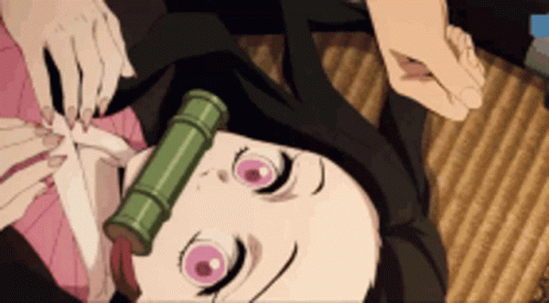 A Girl With Pink Eyes And A Bamboo Tube On Her Head Is Laying Down . GIF