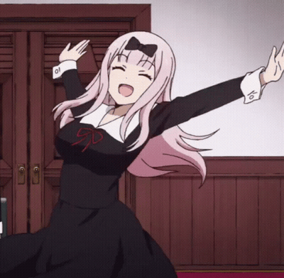 A Girl With Pink Hair And A Bow On Her Head Is Dancing GIF