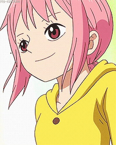 A Girl With Pink Hair And A Yellow Shirt Is Smiling GIF