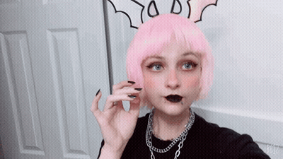 A Girl With Pink Hair And Black Nails Is Taking A Picture With B612 GIF